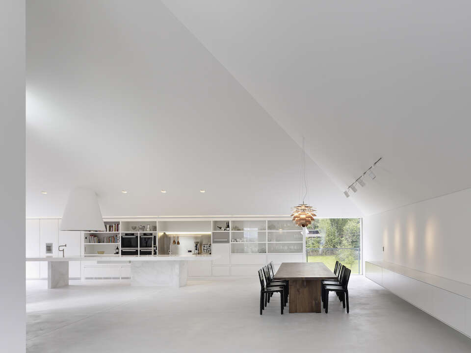 Interior of a minimalist concrete house with white walls